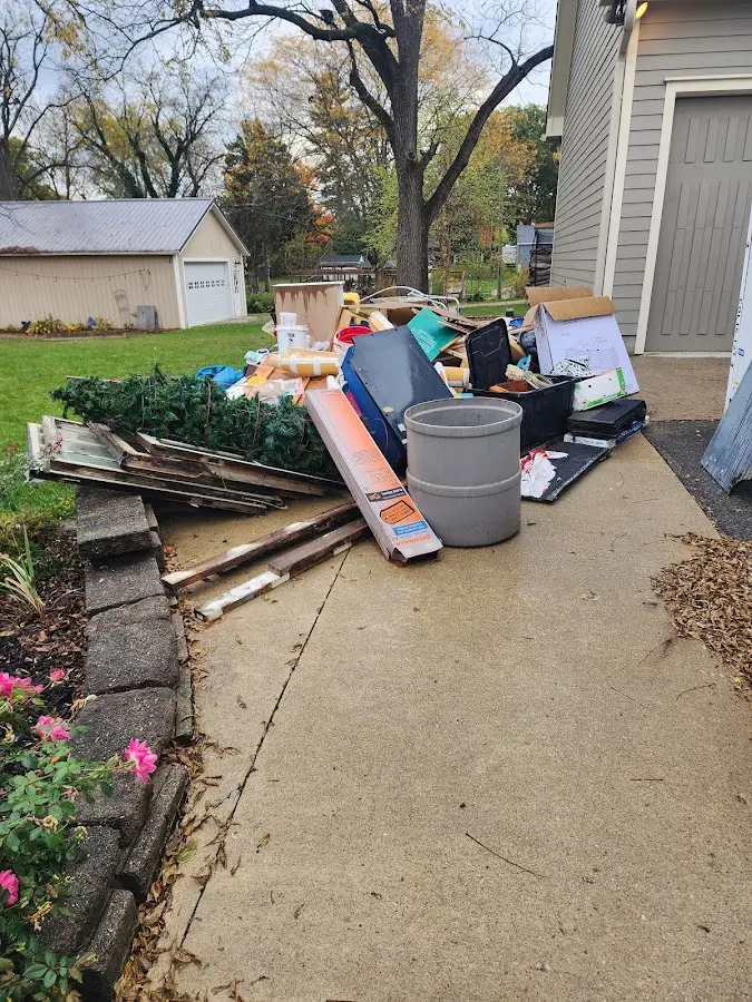 Dumpster being loaded with debris for 3 Yard Dumpster Rental in Vandalia